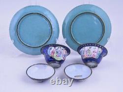 A pair of antique Chinese Canton enamel tea cups with saucers, 18thC