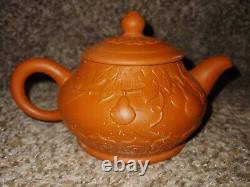 Antique ceremonial red clay tea set with unique raised design. Never been used