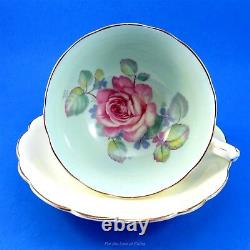 Huge Pink Rose on Green Background with Pale Yellow Paragon Tea Cup and Saucer