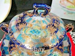 Nippon tea cup and saucer cobalt blue gold gilt covered lid teacup Japan footed