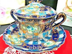 Nippon tea cup and saucer cobalt blue gold gilt covered lid teacup Japan footed