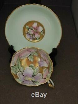 Paragon TeaCup and Saucer Pale Green, Gold Cup Interior with flowers