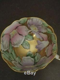 Paragon TeaCup and Saucer Pale Green, Gold Cup Interior with flowers