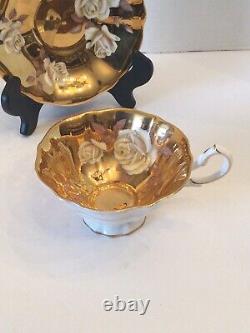 Rare Queen Anne White Floral Rose With Gold Guided background Teacup And Saucer