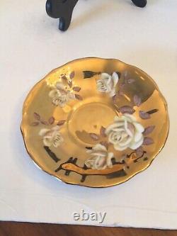 Rare Queen Anne White Floral Rose With Gold Guided background Teacup And Saucer