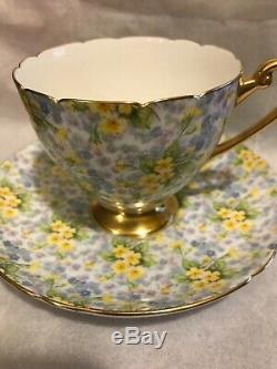 Shelley Primrose Chintz Teacup Saucer Gold Rim Yellow Flowers Footed