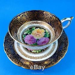 Striking Chrysanthemum Center with a Gold and Cobalt Paragon Tea Cup and Saucer