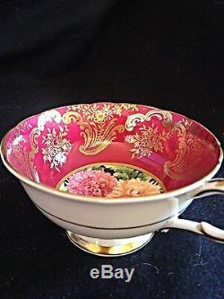 Stunning paragon tea cup Red ground with Gold Intricate Guilding And Mums