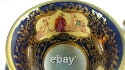 Tea cups & saucers. Sevres style painted panel inside Cobalt blue & antique gold